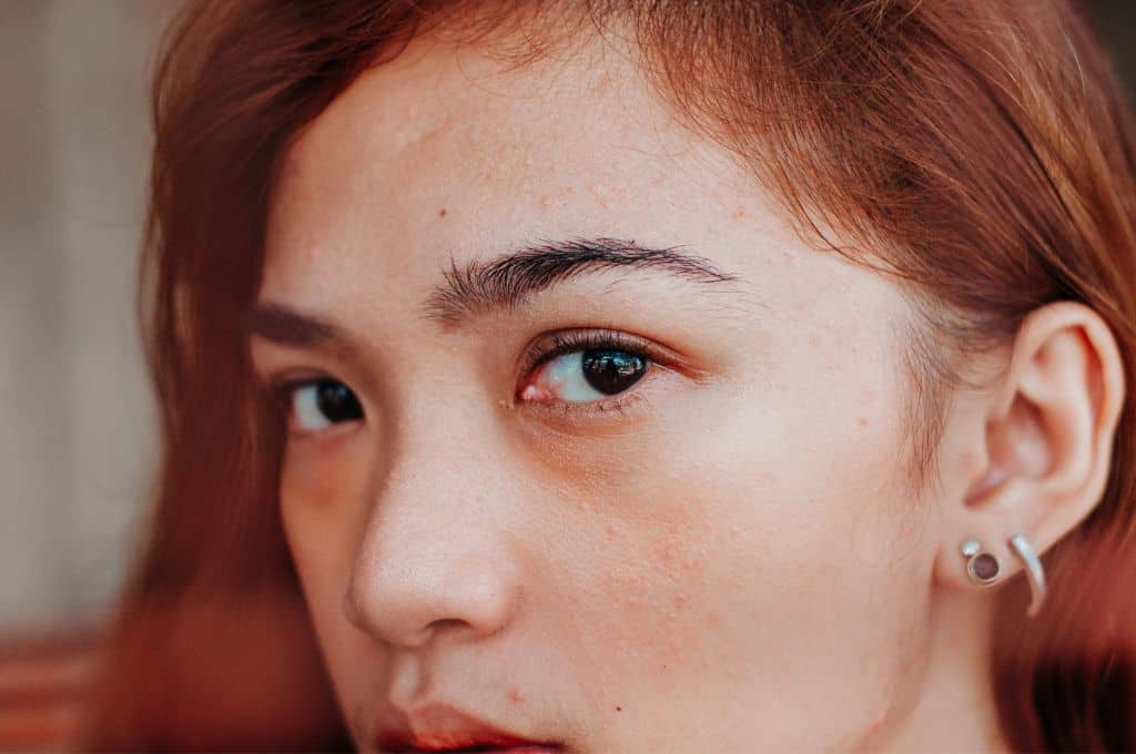 An Asian woman with dark brown eyes