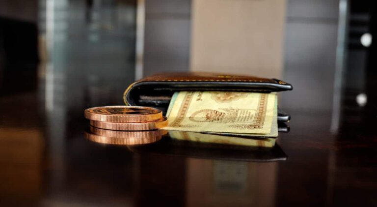 A brown wallet on a table