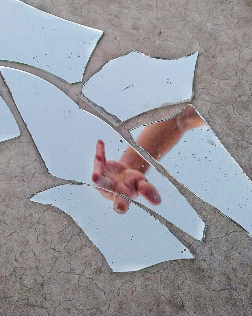 Pieces of broken mirror on the floor