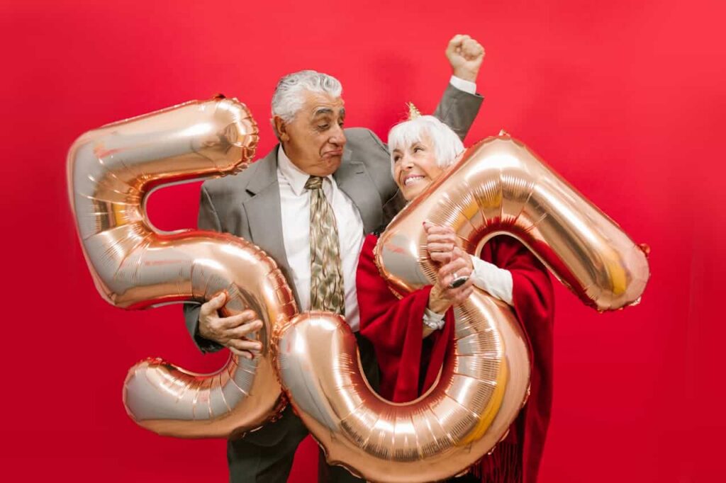 Couple with number 55 balloons
